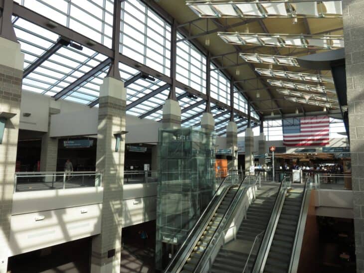 Interior of the T. F. Green terminal with skylights and escalators