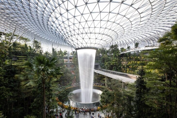Rain Vortex at Jewel Changi Airport surrounded by indoor forest under a glass dome