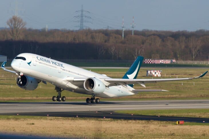 Cathay Pacific Airbus A350-900 B-LRJ lifting off from a runway