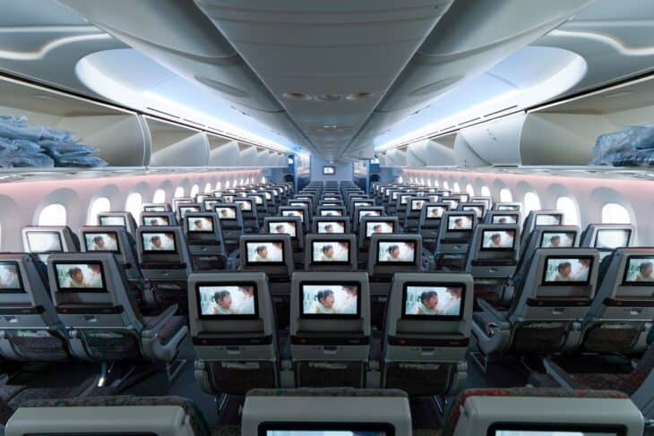 EVA Air Boeing 787-9 economy cabin looking down the aisle at rows of seatback screens