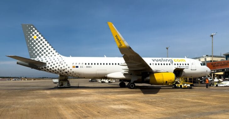 Vueling Airbus A320 EC-MBS in white livery with yellow engines and the dotted tail