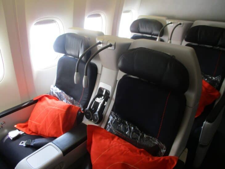Air France premium economy seats with red blankets on a Boeing 777-200ER