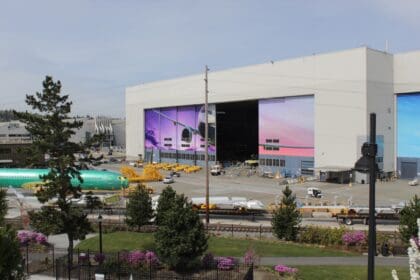Boeing's Renton factory in Washington, where 737 MAX jets are built, seen from the south with a green-primed fuselage at left