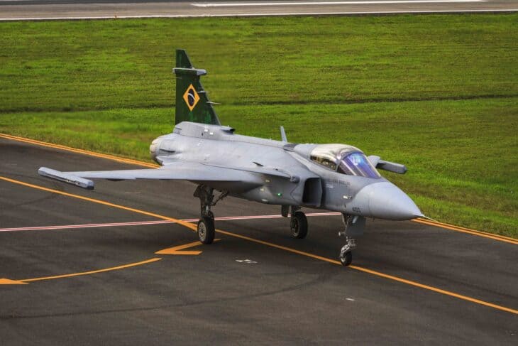 Brazilian Air Force F-39E Gripen taxiing on the ramp with its green tail flash