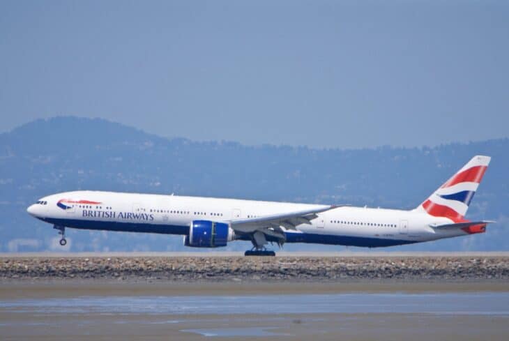 British Airways Boeing 777-300 G-STBJ touching down at San Francisco International Airport with thrust reversers deploying