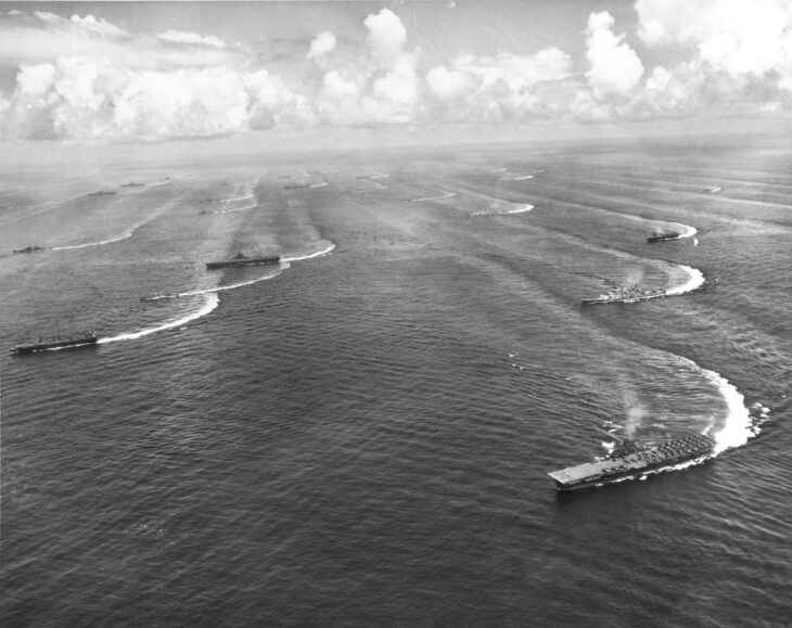 Aerial view of Task Force 38 ships steaming in line off Japan in August 1945