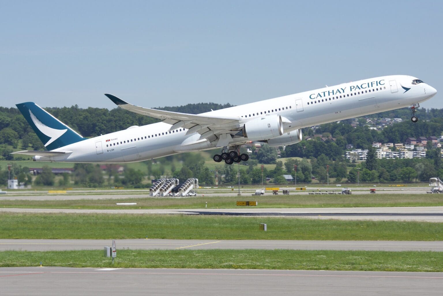 Cathay Pacific Airbus A350-1000 lifting off from a runway with gear retracting