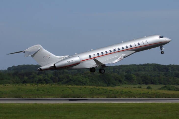 Bombardier Global 7500 in VistaJet livery rotating on takeoff with landing gear retracting