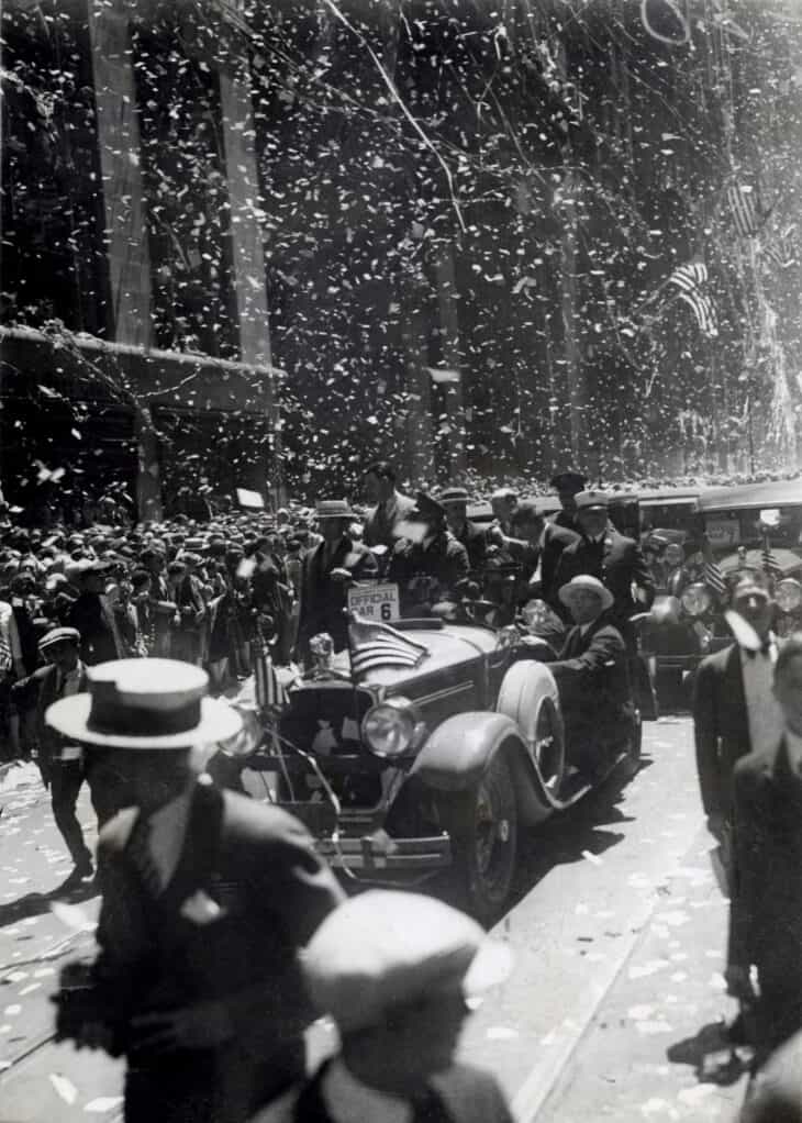 Confetti falling over a motorcade during Charles Lindbergh's 1927 parade in New York