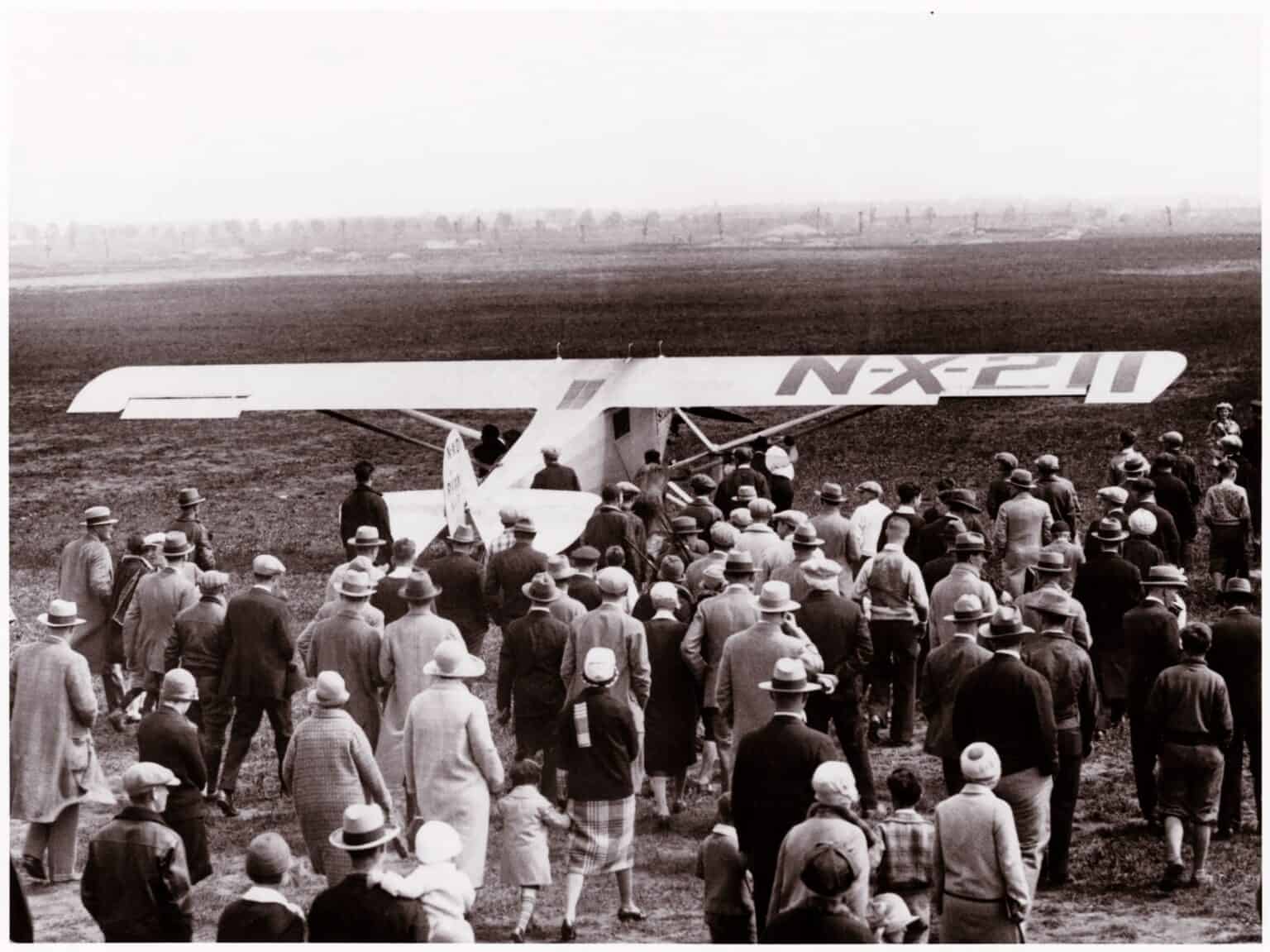 Crowd gathered around the Spirit of St. Louis, marked NX-211, at Roosevelt Field before Lindbergh's May 1927 takeoff