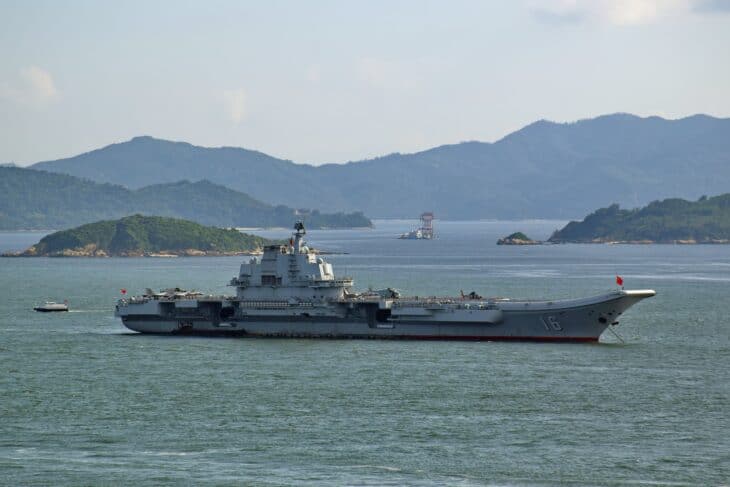 Chinese aircraft carrier Liaoning (CV-16) underway among islands
