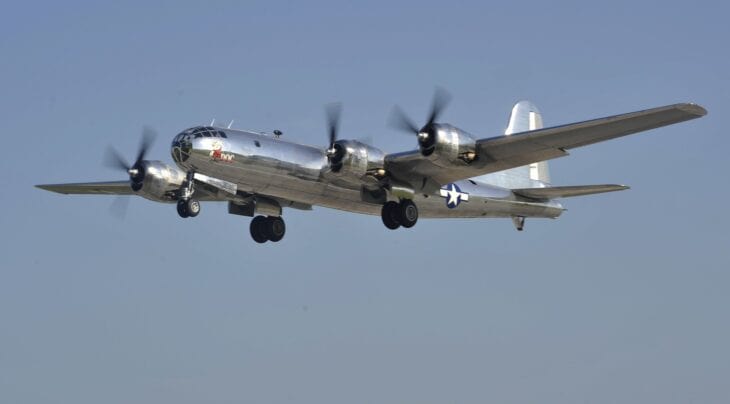 Boeing B-29 Superfortress bomber flying against a clear sky