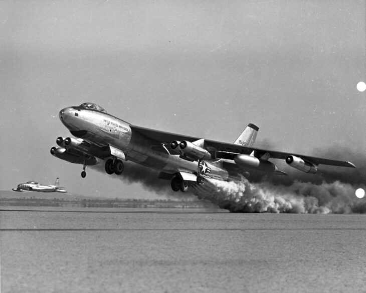 Boeing B-47 Stratojet taking off with rocket-assisted takeoff smoke streaming behind