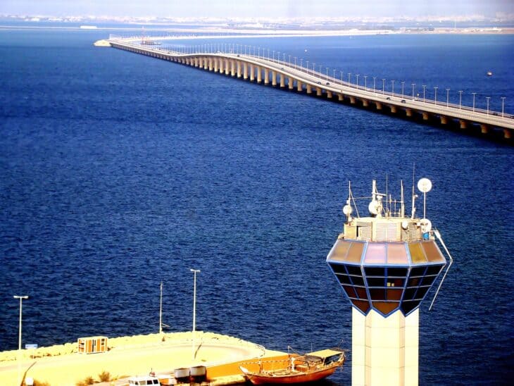 The King Fahd Causeway crossing the water between Saudi Arabia and Bahrain, with a control tower in the foreground
