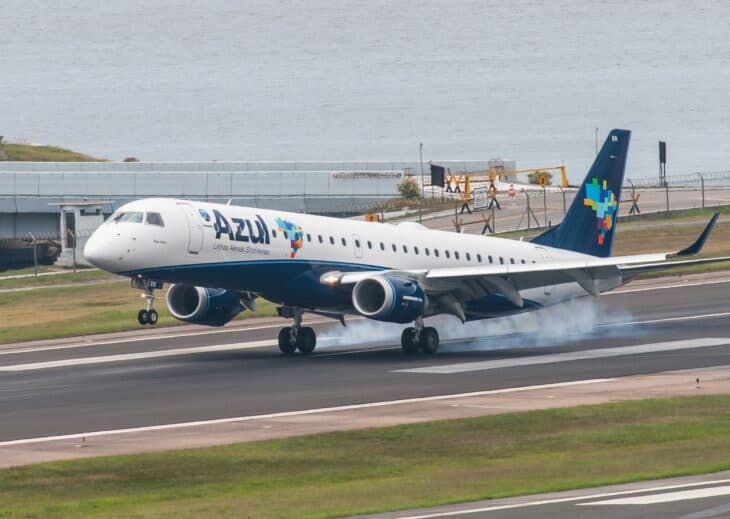 Azul Embraer 195 touching down with tire smoke
