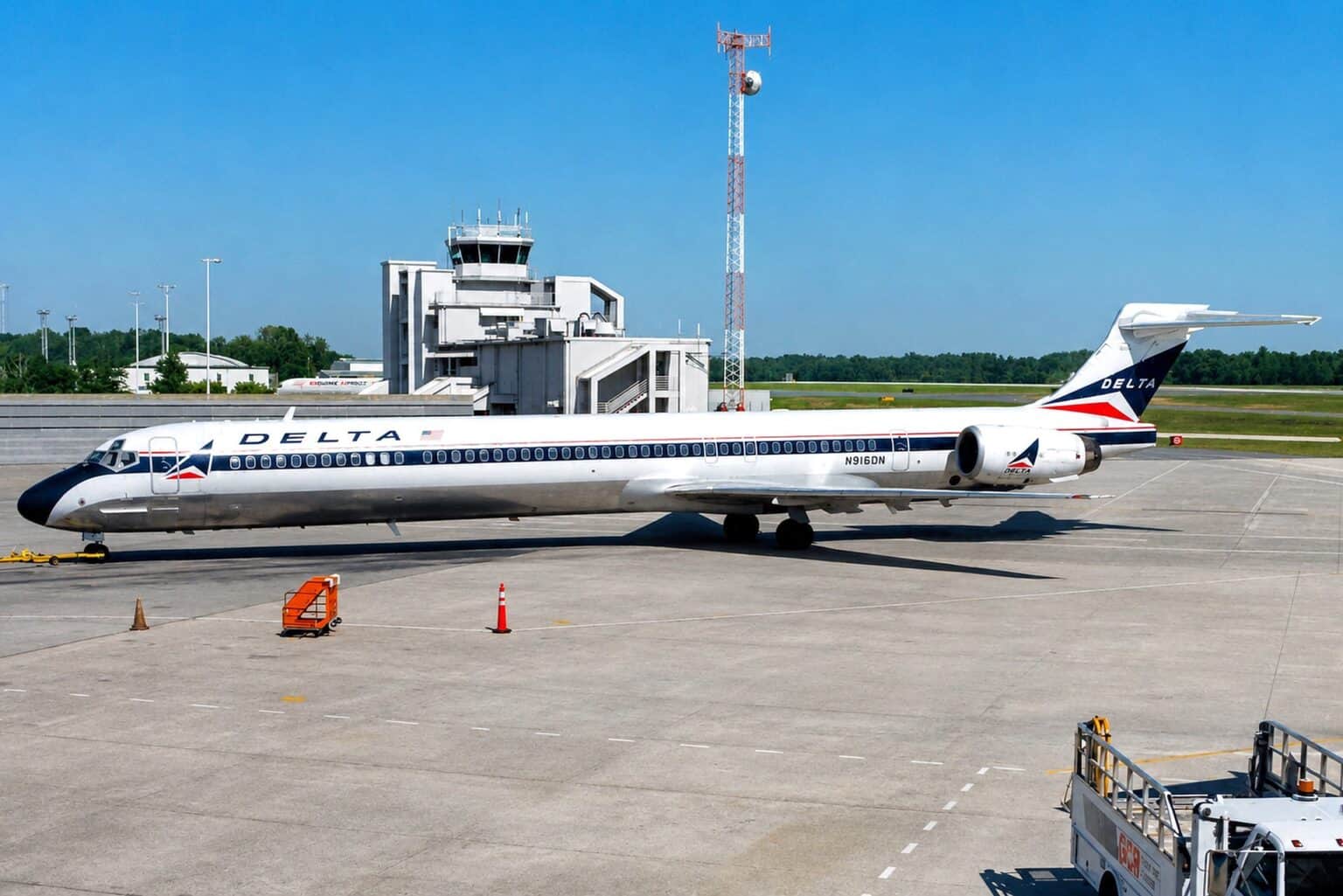 Delta Air Lines McDonnell Douglas MD-90 N916DN parked on the ramp in front of the control tower at Pensacola International Airport