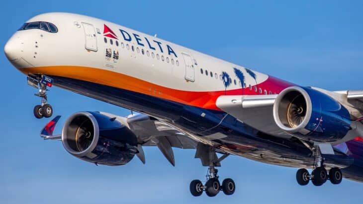 Delta Airbus A350-900 in the LA 2028 Olympic livery climbing out with gear down against a blue sky