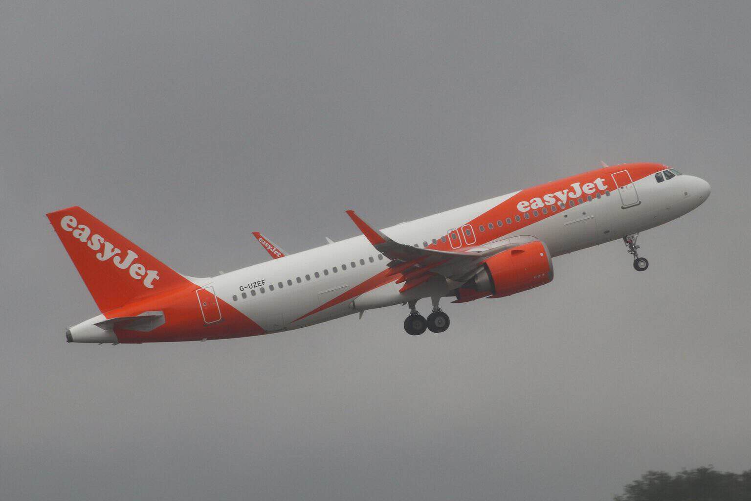 easyJet Airbus A320neo G-UZEF climbing away after takeoff with its landing gear retracting