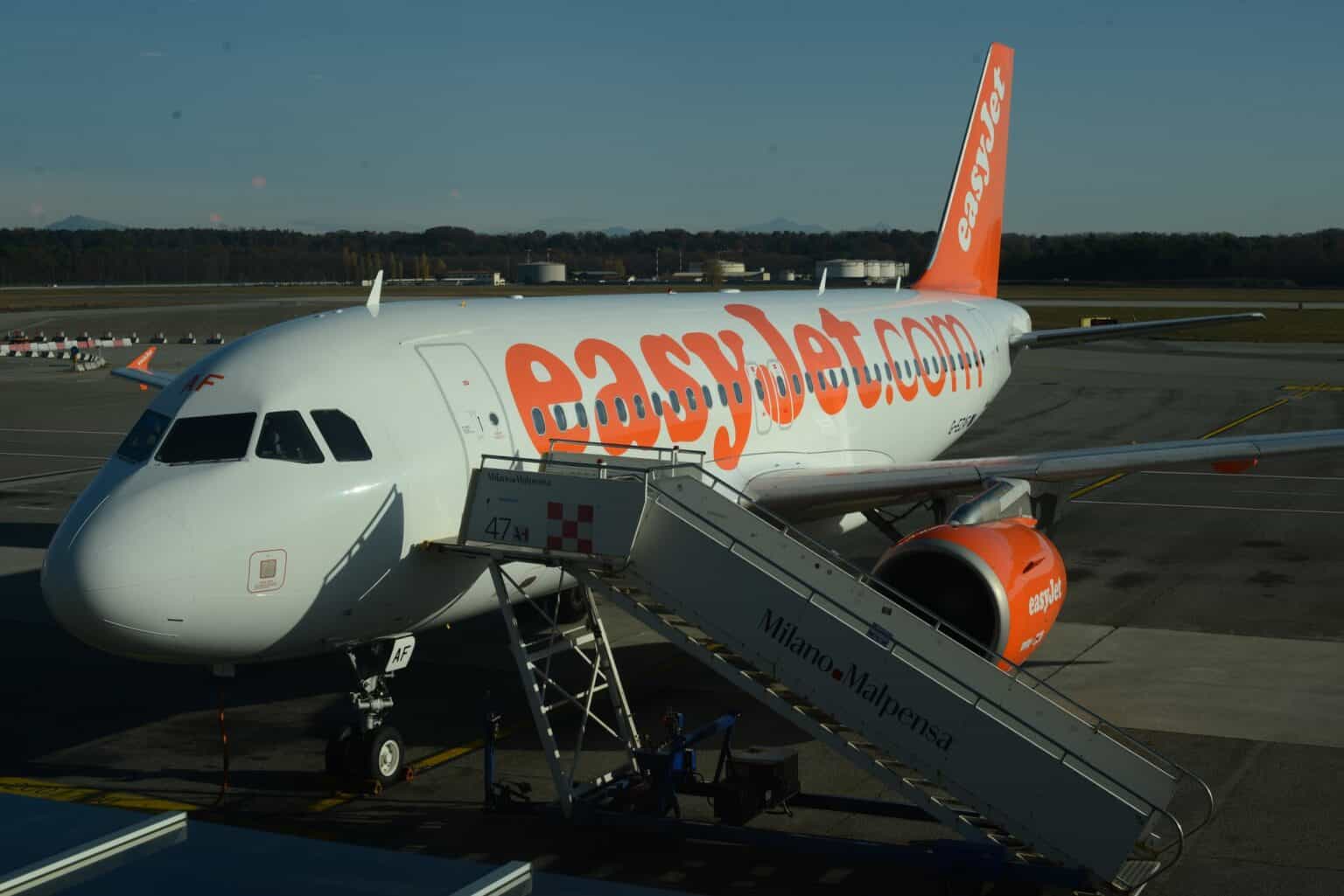 easyJet Airbus A319 G-EZAF parked at Milan Malpensa with Malpensa-branded boarding stairs at its front door