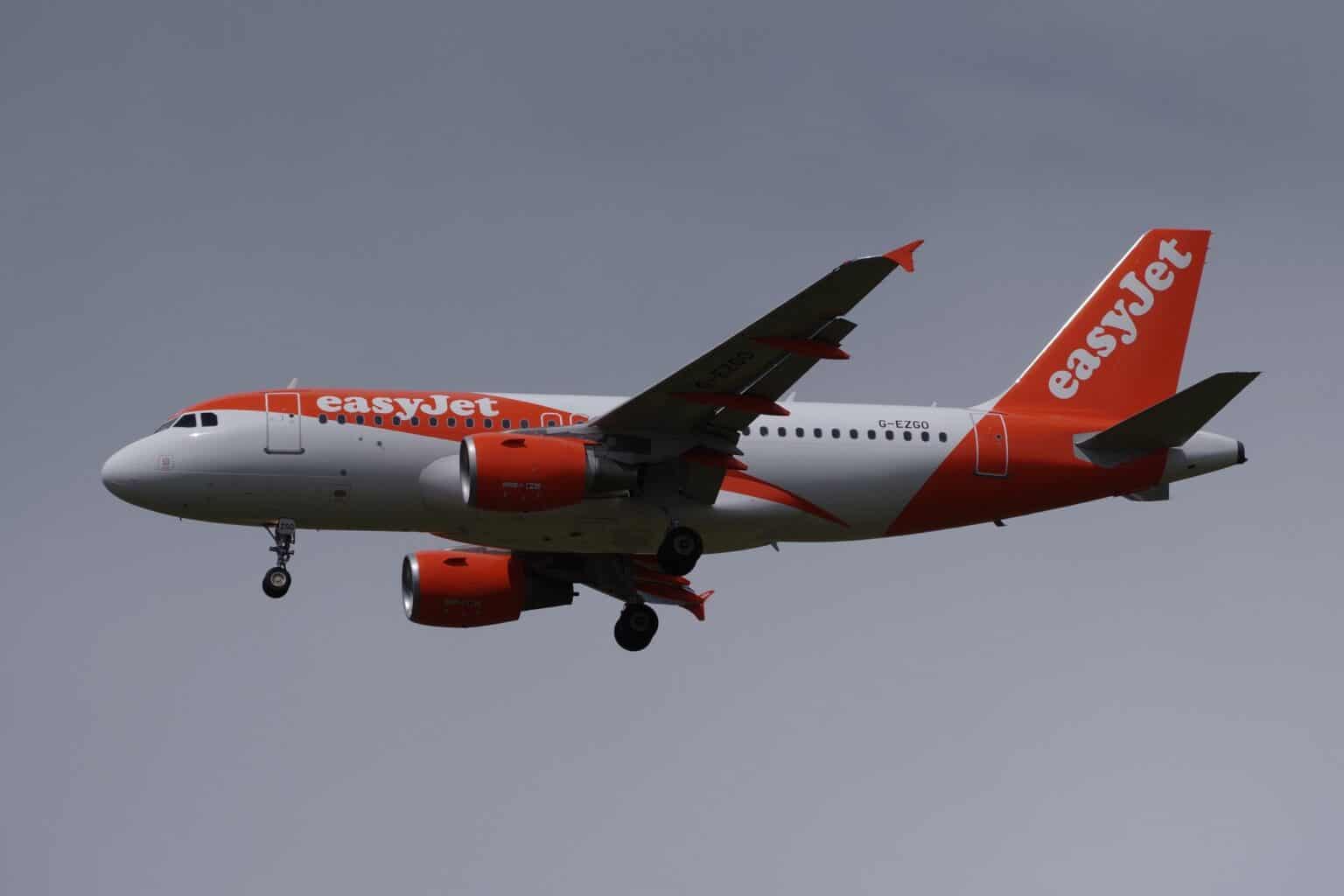 easyJet Airbus A319 G-EZGO on approach with its landing gear down against a gray sky