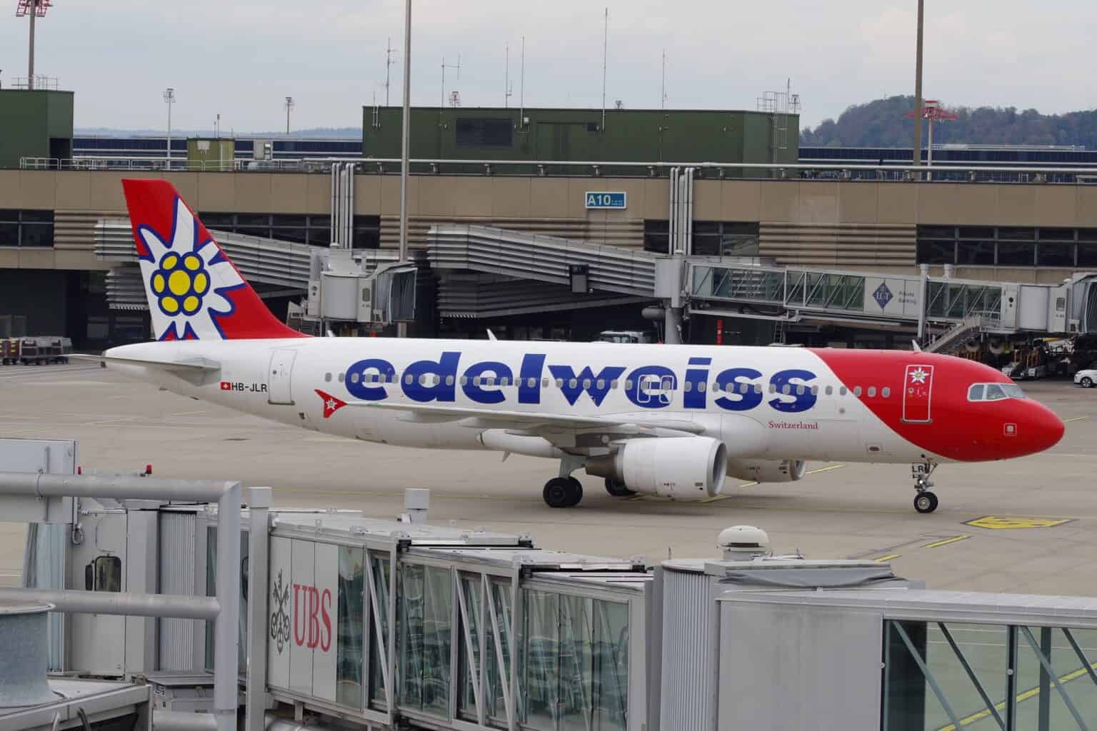 Edelweiss Airbus A320 HB-JLR taxiing past a terminal at Zurich Airport