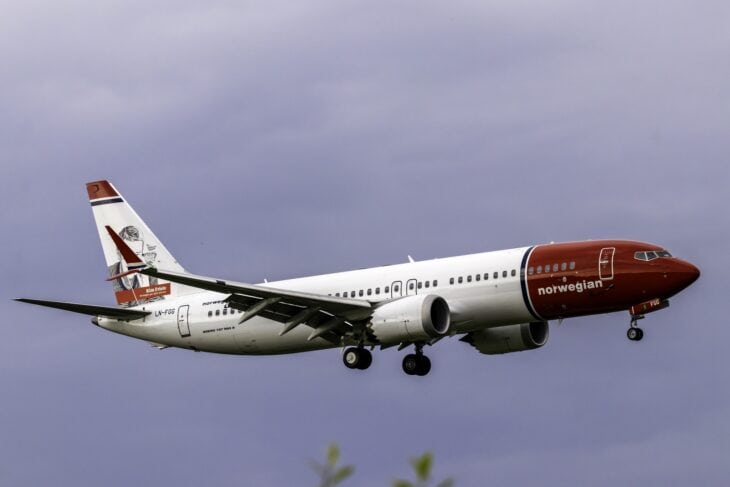Norwegian Boeing 737 MAX 8 LN-FGG on approach with a tail fin hero portrait on its fin