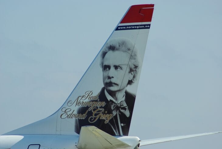 Composer Edvard Grieg's portrait painted on the tail fin of a Norwegian Boeing 737-800, registration LN-NOB