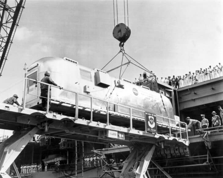 Apollo 11 Mobile Quarantine Facility lifted aboard USS Hornet (CV-12) at Pearl Harbor in July 1969