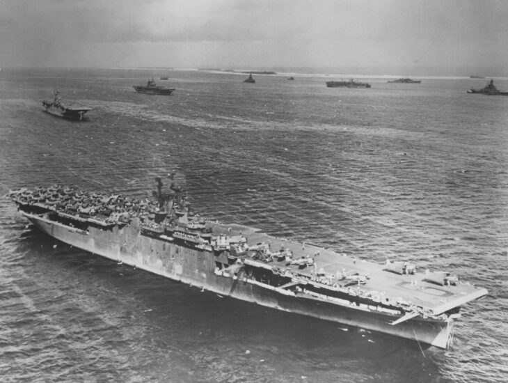 USS Essex (CV-9) at anchor at Majuro Atoll in March 1944 with other carriers behind