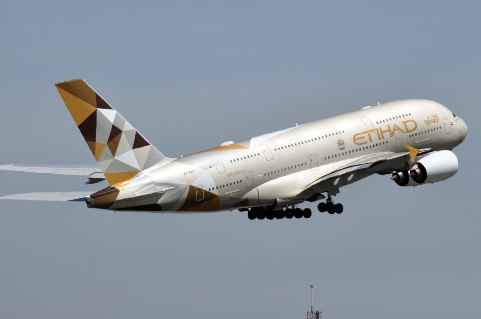 Etihad Airways Airbus A380 A6-APD climbing out with gear retracting