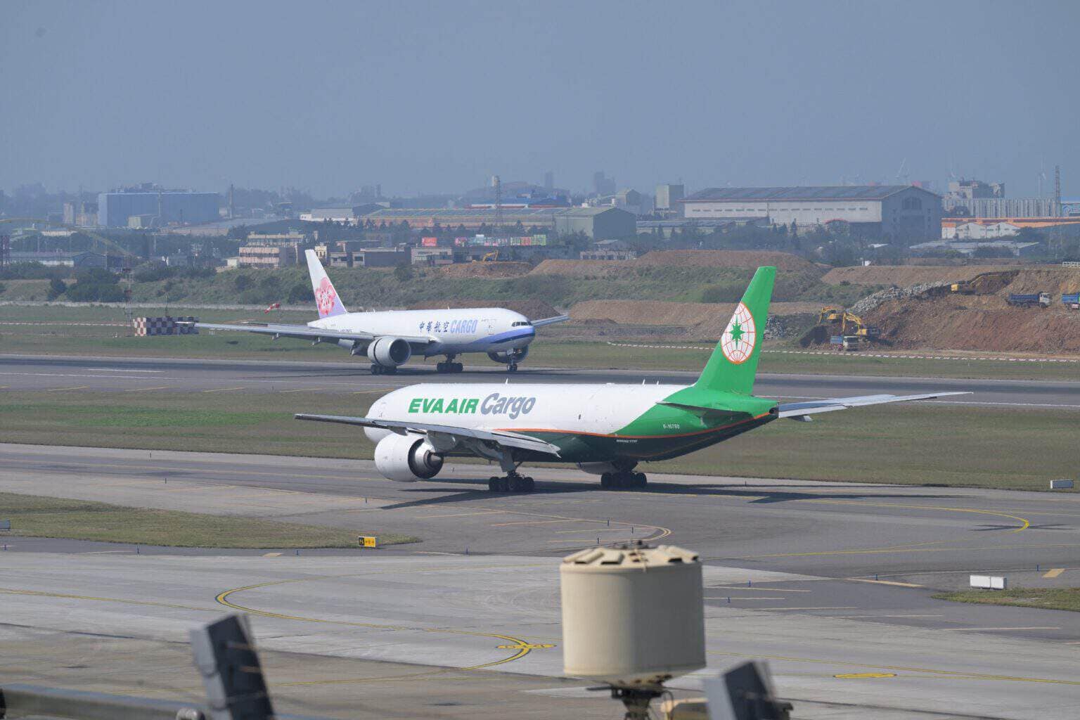 EVA Air Cargo Boeing 777F taxiing at Taoyuan with a China Airlines Cargo 777F behind it
