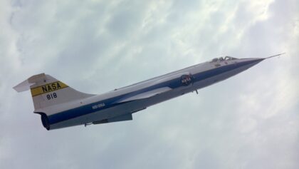 NASA F-104A Starfighter N818NA climbing through broken cloud