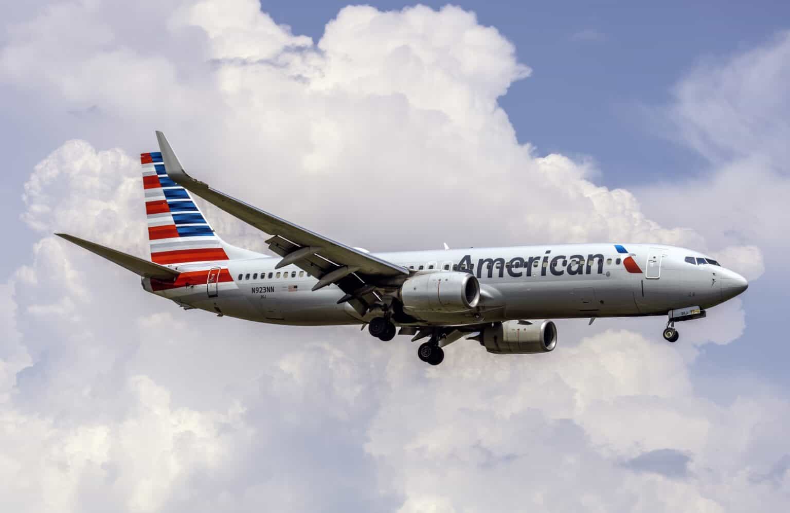 American Airlines Boeing 737-800 on approach against a cloudy sky