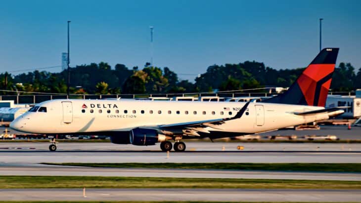 Delta Connection Embraer E175 operated by Republic Airways rolling down the runway, one underwing engine visible