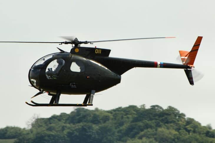 Hughes OH-6A Cayuse light observation helicopter in flight at Duxford