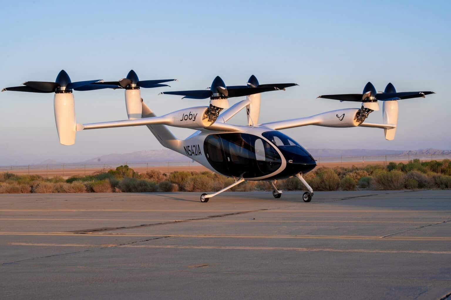 Joby S4 electric aircraft parked on the ramp at Edwards Air Force Base at dusk