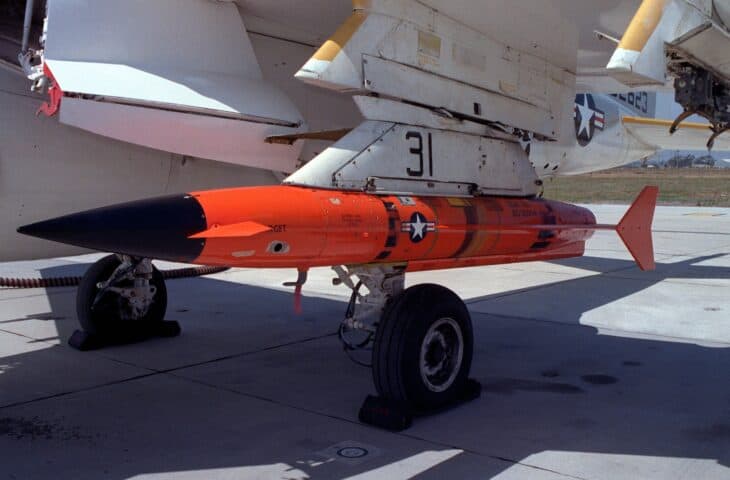 Orange AQM-37 target drone mounted under the wing of a US Navy A-6E Intruder