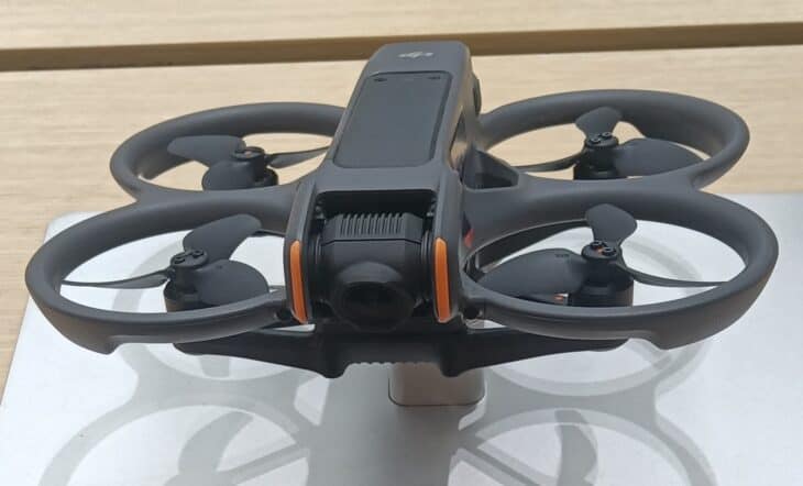 DJI Avata 2 drone with its propeller guards, shown close up on a display stand
