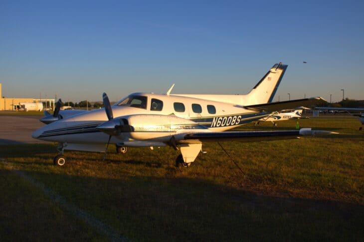 Beechcraft Duke B60 N6008S parked on a ramp at sunset