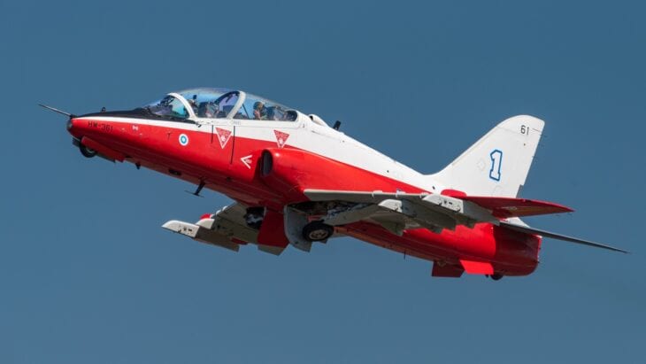 Finnish Air Force BAE Hawk Mk.66 in red-and-white training colours climbing away