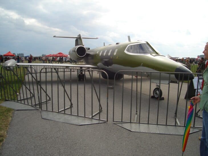 Finnish Air Force Learjet 35AS in olive camouflage parked at an air show