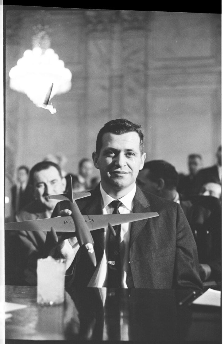 Francis Gary Powers seated at the Senate Armed Services Committee hearing with a U-2 model in front of him