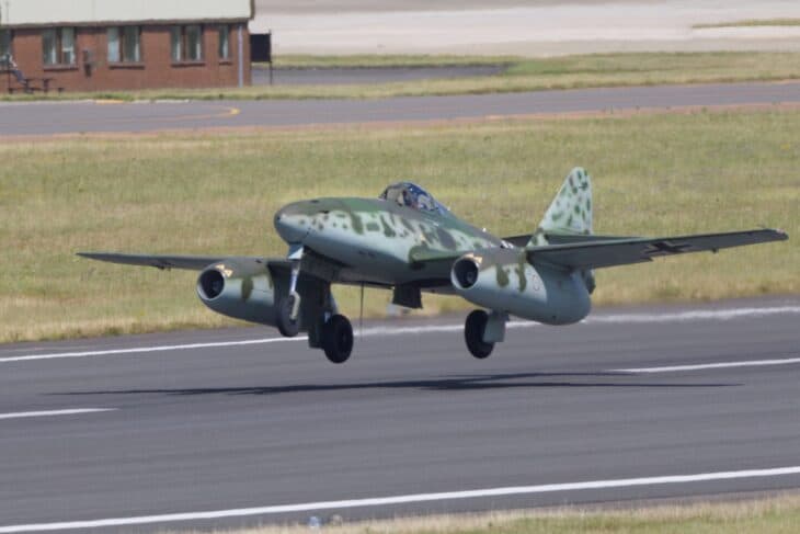 Messerschmitt Me 262 jet lifting off a runway with gear still down