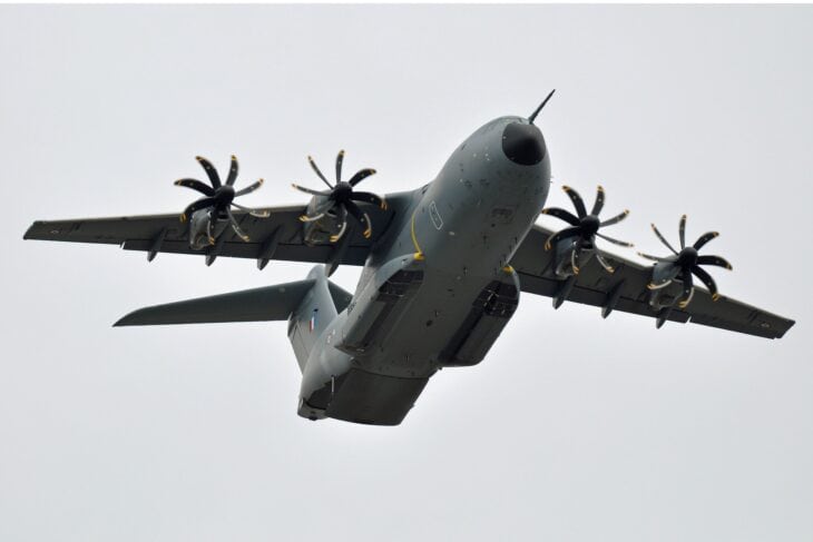 French Air and Space Force Airbus A400M Atlas F-RBAP banking overhead with its eight-bladed propellers turning
