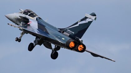 French Air and Space Force Dassault Rafale C climbing away in full afterburner with its landing gear retracting