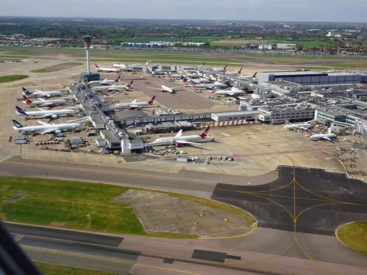 Aerial view of aircraft parked around the terminal piers at London Heathrow Airport