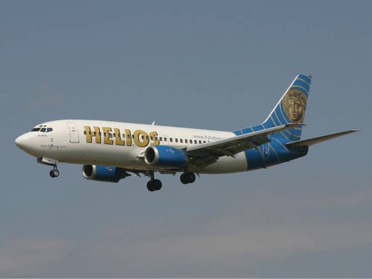Helios Airways Boeing 737-300 5B-DBY in flight with landing gear down