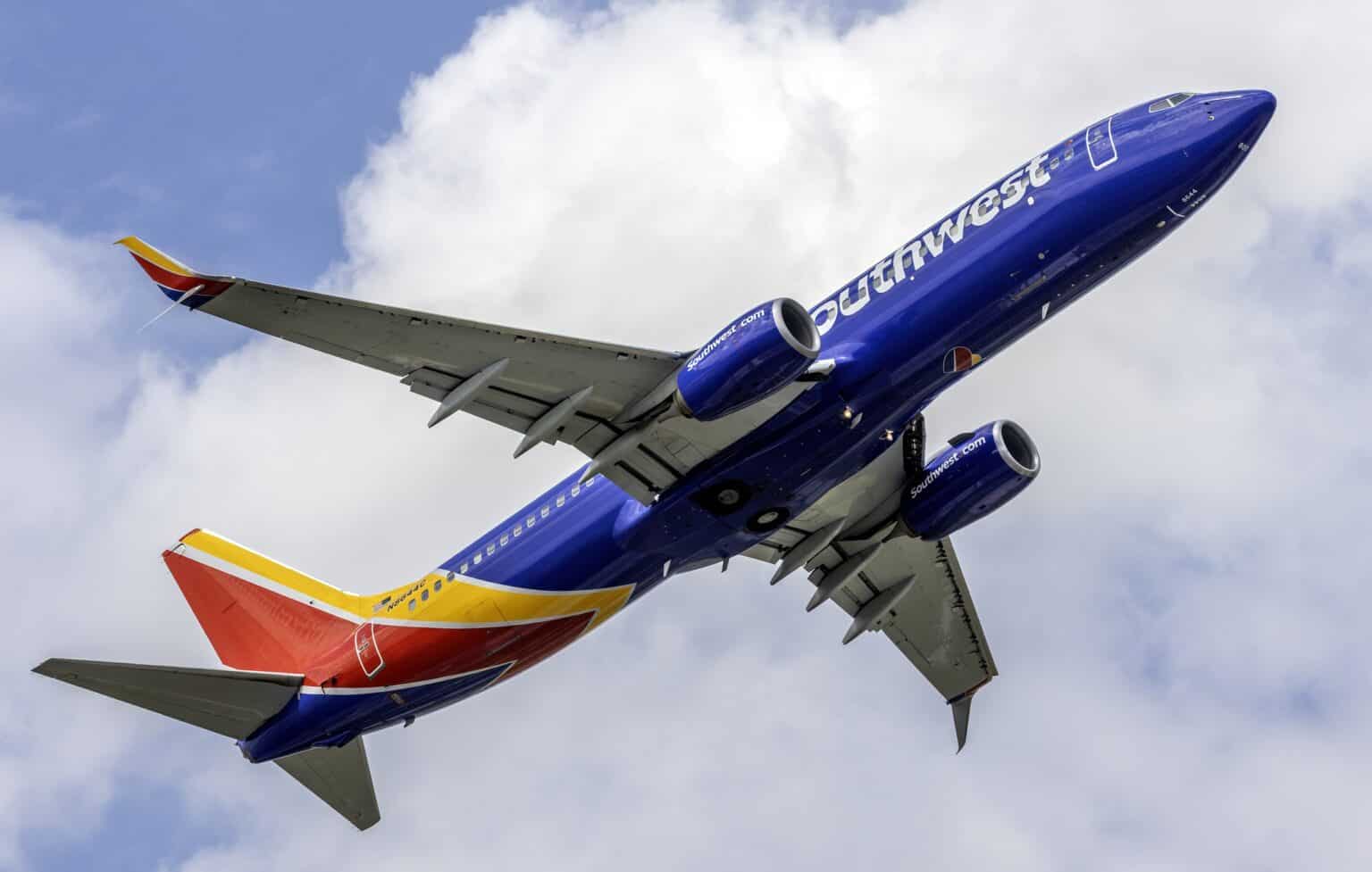 Southwest Airlines Boeing 737-800 banking steeply against clouds