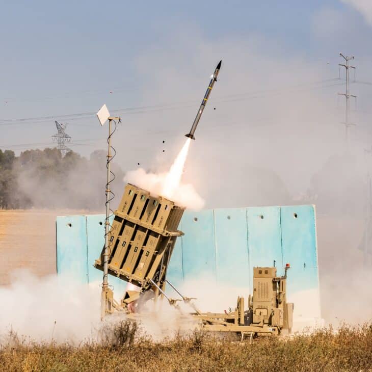 A Tamir interceptor rising on a plume of smoke from an Iron Dome launcher during a 2021 firing