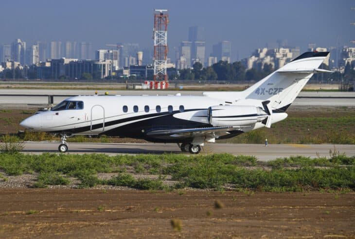 Hawker 800XP 4X-CZF taxiing with the Tel Aviv skyline behind
